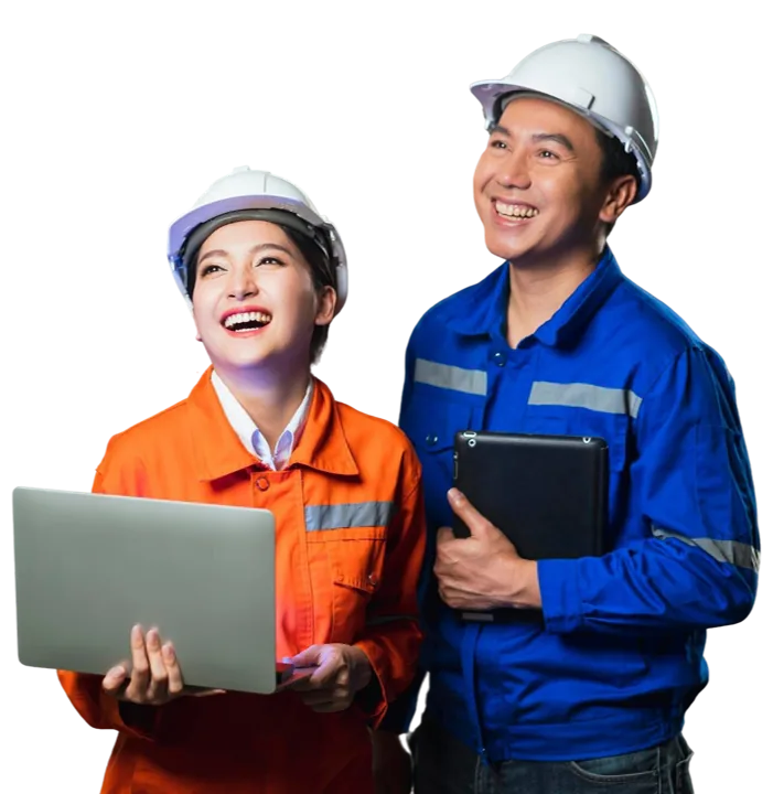Two Qlean Tech engineers in hard hats and safety coveralls, one holding a laptop and one a tablet